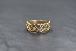 A 9ct gold Celtic knot motif ring, of pierced interlocking design, marked 375, ring size W, 2.9g
