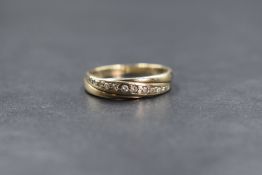 A 9ct gold band ring having an inset diagonal line of small diamonds, size P & approx 2.4g