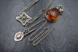 Three pieces of silver jewellery including a watch chain with shield medallion and T bar,
