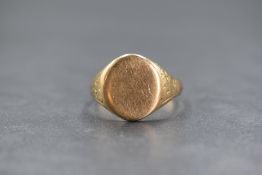 A gent's yellow metal signet ring stamped 9ct, of plain/worn form, loop split, size T & 5.8g