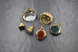 Six assorted 9ct gold and yellow metal fob seals including four stamped 9ct/375, one stamped 10