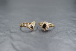 A 9ct gold sapphire and cubic zirconia set cluster ring, the oval cut sapphire in a ten cubic