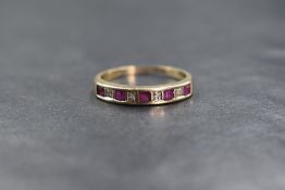 A 9ct gold ruby and diamond set half eternity, the five princess cut rubies interspersed with four