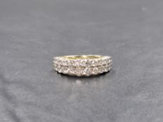 An 18ct gold diamond double row half eternity ring having twenty lab grown diamonds, total approx