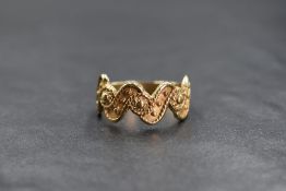 A 9ct gold decorative wave ring, having rope motif and beadwork decoration, marked 375, ring size
