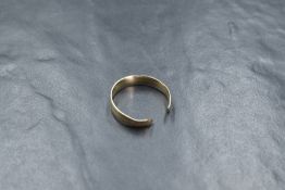 An 18ct gold two tone band, the white gold band having a yellow gold channel decoration, the band