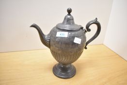 An interesting Victorian teapot, of traditional ovoid form with scroll handle reeded spout and