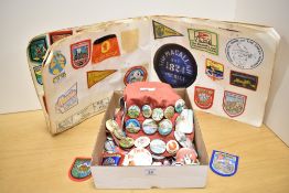 A collection of 20th-century assorted souvenir pin badges, fabric badges and stickers, to include