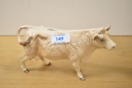 A 20th-century Beswick pottery Charolais Cow figurine, model 3075A, with a light brown glossy