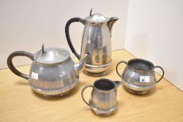 An attractive Hutton Sheffield planished English pewter four piece teaset, comprising teapot, hot