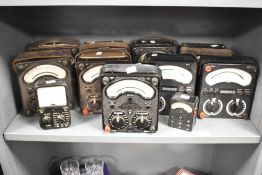 A large quantity of vintage AVO multimetres, combining a voltmetre, ammeter, and ohmmeter into one