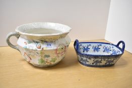 A 19th-century Masons Ironstone chamber pot, featuring colourful floral and foliate decorations with