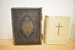Two 20th-century Holy Bibles, to include an earlier leather-bound and brass-adorned example and a