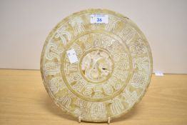 A decorative Chinese carved and pierced mottled stone Bi/Yubi type disc/carving, of circular form
