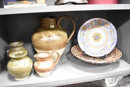 A quantity of 20th-century studio pottery; to include a large decorative charger with floral and