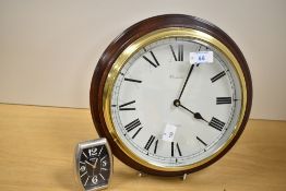 A contemporary Comitti London handmade solid mahogany wall Clock, with quartz precision movement,