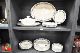 A quantity of 20th-century Royal Doulton translucent china 'Burgundy' tableware, featuring a