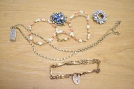 A small quantity of costume jewellery, to include two brooches, a rolled gold three bar gate