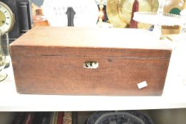 An early 20th-century mahogany writing slope, having interior compartments, soft green slope and a