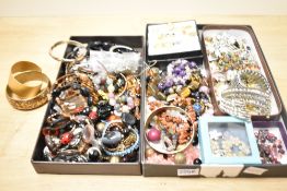 A collection of costume jewellery, including semi-precious bracelets including tigers-eye,
