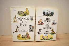 Two late 20th-century A. A. Milne Winnie the Pooh hardback books, with original illustrated dust