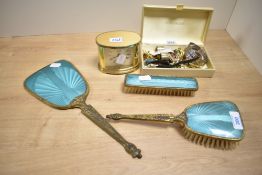 A small collection of costume jewellery, including brooches, a vintage Waltham wristwatch, and a
