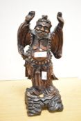 A 20th-century Chinese hand carved hardwood figure, most likely depicting a mortal or immortal