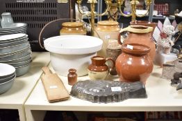 A quantity of late 19th to early 20th-century kitchenware, to include two large stoneware storage