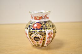 A small 20th-century Royal Crown Derby Bone China 'Old Imari' bud vase, of baluster form,