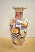 A 20th-century Japanese Satsuma ware vase, of baluster form, featuring an elaborate hand-painted