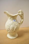 An unusual early 20th-century commemorative pottery water jug, moulded with the Royal Cipher of