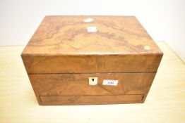 A Victorian figured-walnut travelling vanity dressing case, containing original fitted white metal-