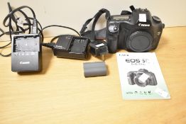 Canon EOS 5D digital camera, with two batteries, battery charger and instructions.