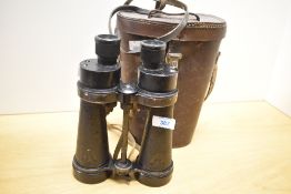 A pair of WWII British Barr and Stroud military binoculars, marked with military arrows to the