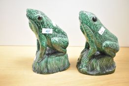A pair of interesting green glazed frog studies, naturalistically modelled with moulded and