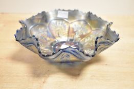 A 20th-century Fenton carnival glass bowl in Amethyst/purple having a ruffled rim, featuring