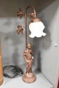A 20th-century Art Nouveau-style copper-coloured spelter table lamp, having a frosted glass tulip-