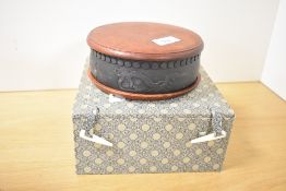 A modern Chinese Duan type inkstone, of circular form with carved recess and repeating borders, sold