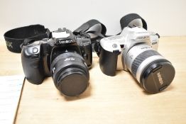 Two Minolta SLR 35mm film cameras - a Minolta Dynax 404si with a 28-80mm f3.5-5.6 Zoom Lens and a
