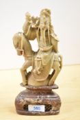 A 20th-century Chinese hardstone carved decorative figure of an immortal, presumed to feature
