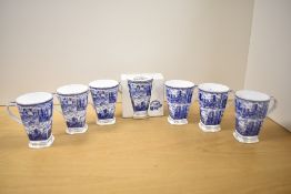 A set of seven Millennium Ringtons Fine Bone China beakers, illustrated in blue and white with