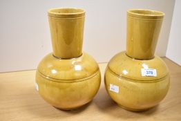 Two 20th-century Dunmore pottery vases, featuring a two-tiered form having a narrow cylindrical