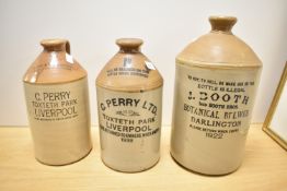 A group of three vintage stoneware flagons, named J Booth Botanical Brewer Darlington and two for