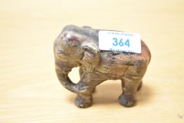 A 20th-century hand carved soapstone elephant figurine, having a sweet expression and delicate