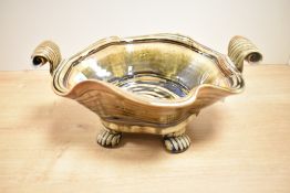 A 20th-century John Calver Studio pottery stoneware bowl, of a wavy organic shape with scrolled