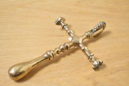 An usual late 19th to early 20th-century brass cruciform pastry jigger, of larger than normal