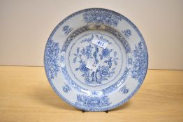A 19th century Chinese export porcelain plate, of dished circular form, hand decorated with