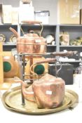 A quantity of late 19th to early 20th-century metalware, to include a large copper whistling tea