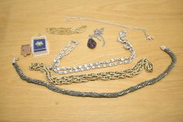 A small collection of costume jewellery, including neck chains, 'F' gold plated stud earrings and