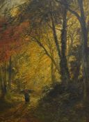 A 20th Century oil on board, depicting a woman carrying fire wood through an Autumnal woodland